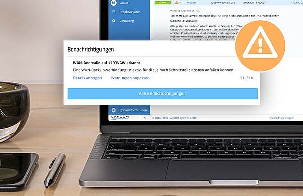 Laptop mit Screenshot der LMC und Warndreieck